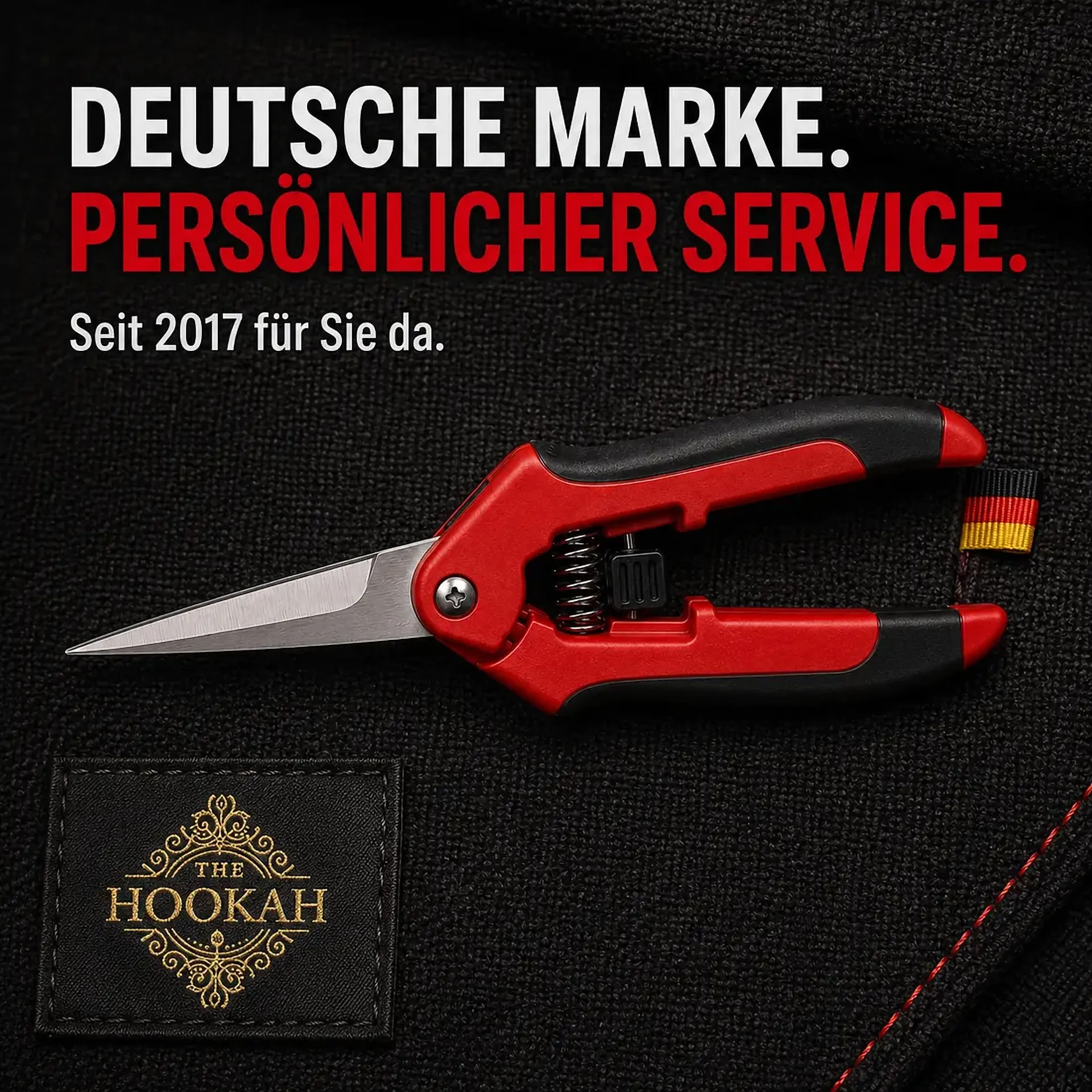 Rote Ernteschere auf schwarzem Stoff mit THE HOOKAH Logo